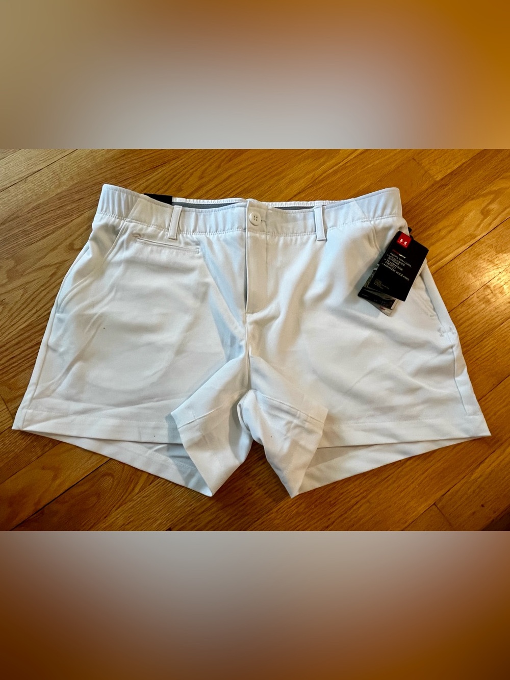 NWT- Under Armour White Performance Golf Shorts, women’s size 12